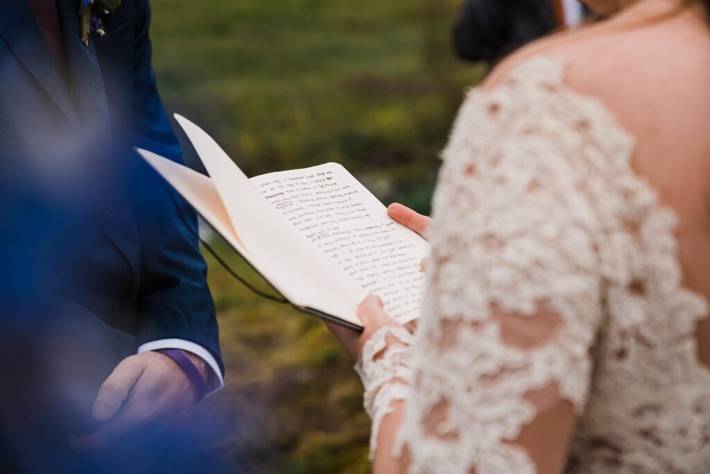 Bride reads handwritten vows during elopement ceremony in Iceland