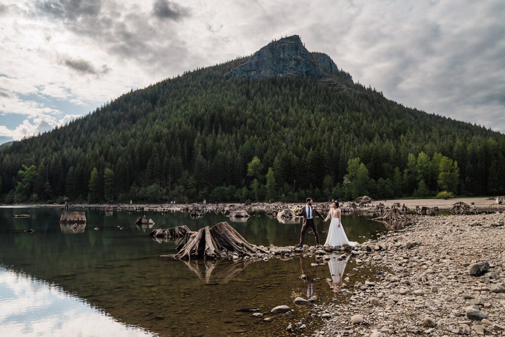 Bride and groom hold hands at their Rattlesnake Lake elopement