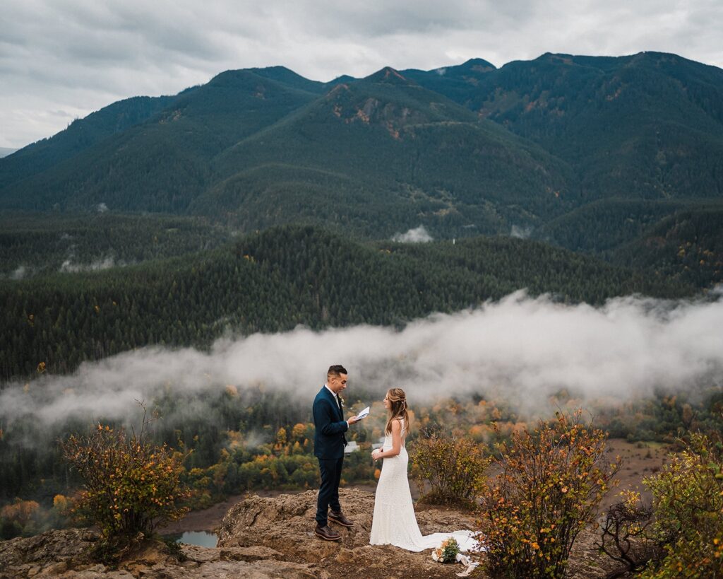 Bride and groom exchange vows during their Snoqualmie Pass elopement