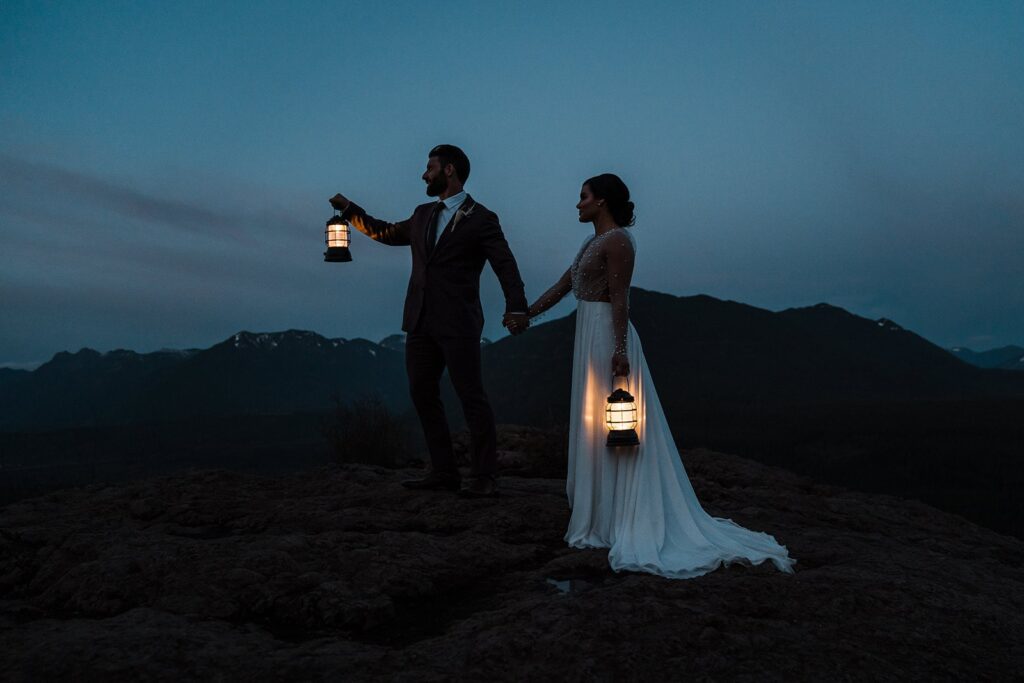 Bride and groom hold lanterns during their blue hour photos in Snoqualmie