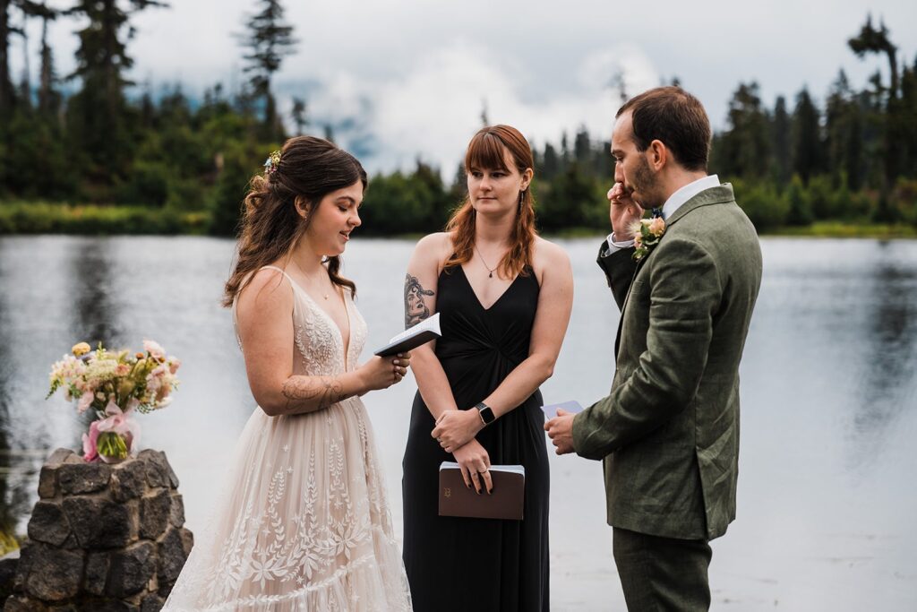 Bride reads vows during rainy wedding ceremony in the North Cascades