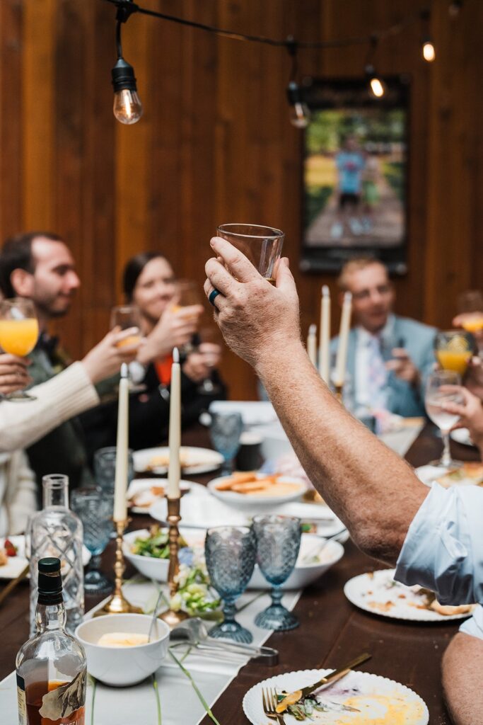 Guests toast to bride and groom during their wedding reception in the North Cascades