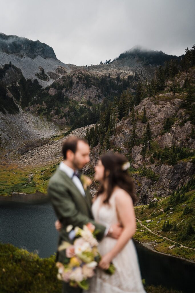 Bride and groom rainy wedding photos in the mountains in the North Cascades