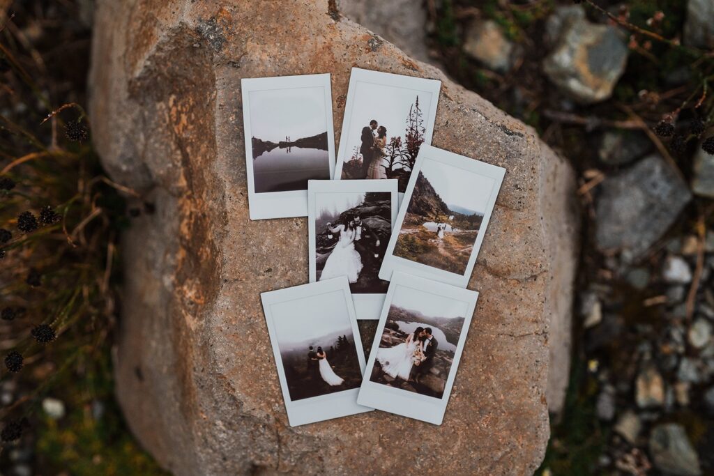 Rainy wedding polaroid photos sitting on a rock in the North Cascades