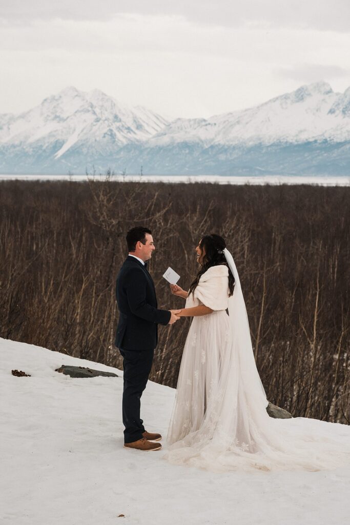 Bride and groom exchange private vows during their elopement in Alaska 