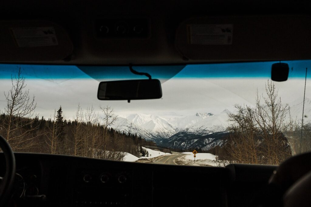 View of snow-capped Alaska mountains from the car 