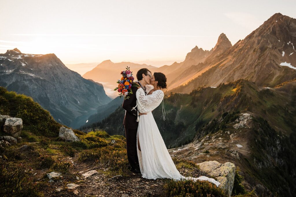 Bride and groom kiss in the North Cascades during their adventure elopement