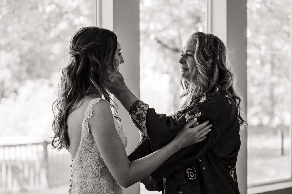 Mother helps bride get ready for her intimate cabin wedding in Washington