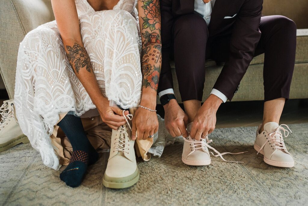 Brides lace up their hiking shoes for their LGBTQ elopement in the Washington mountains