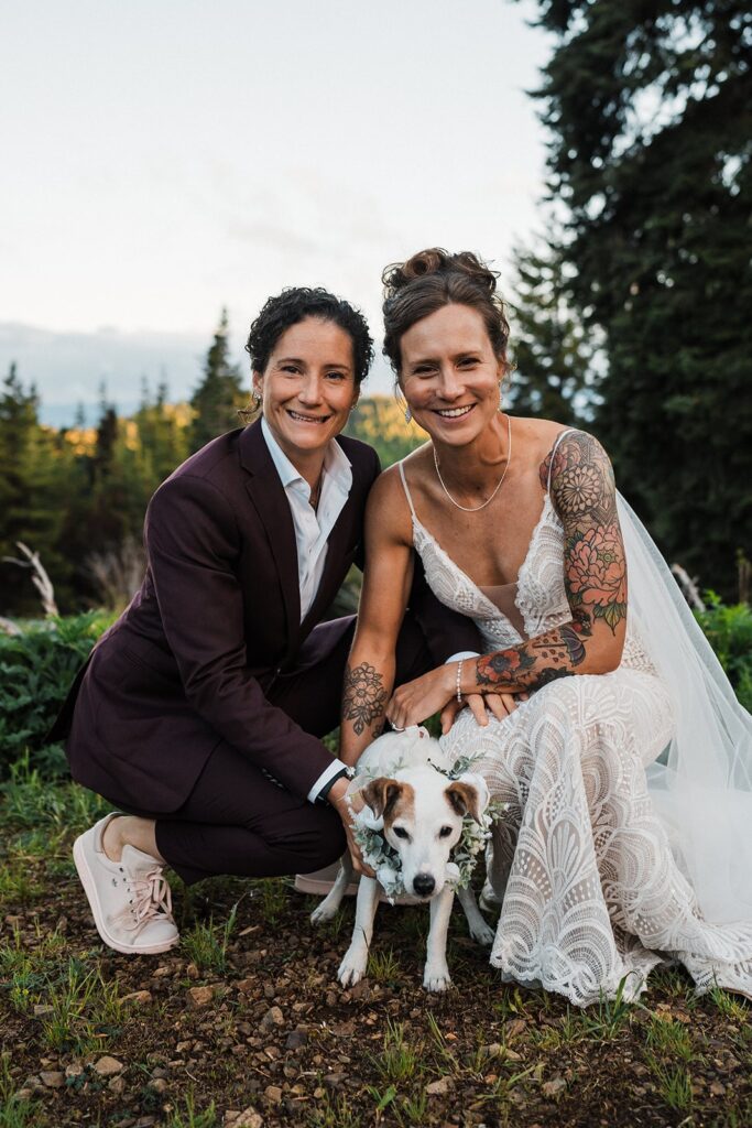 Brides sit with their pup at their Washington LGBTQ elopement