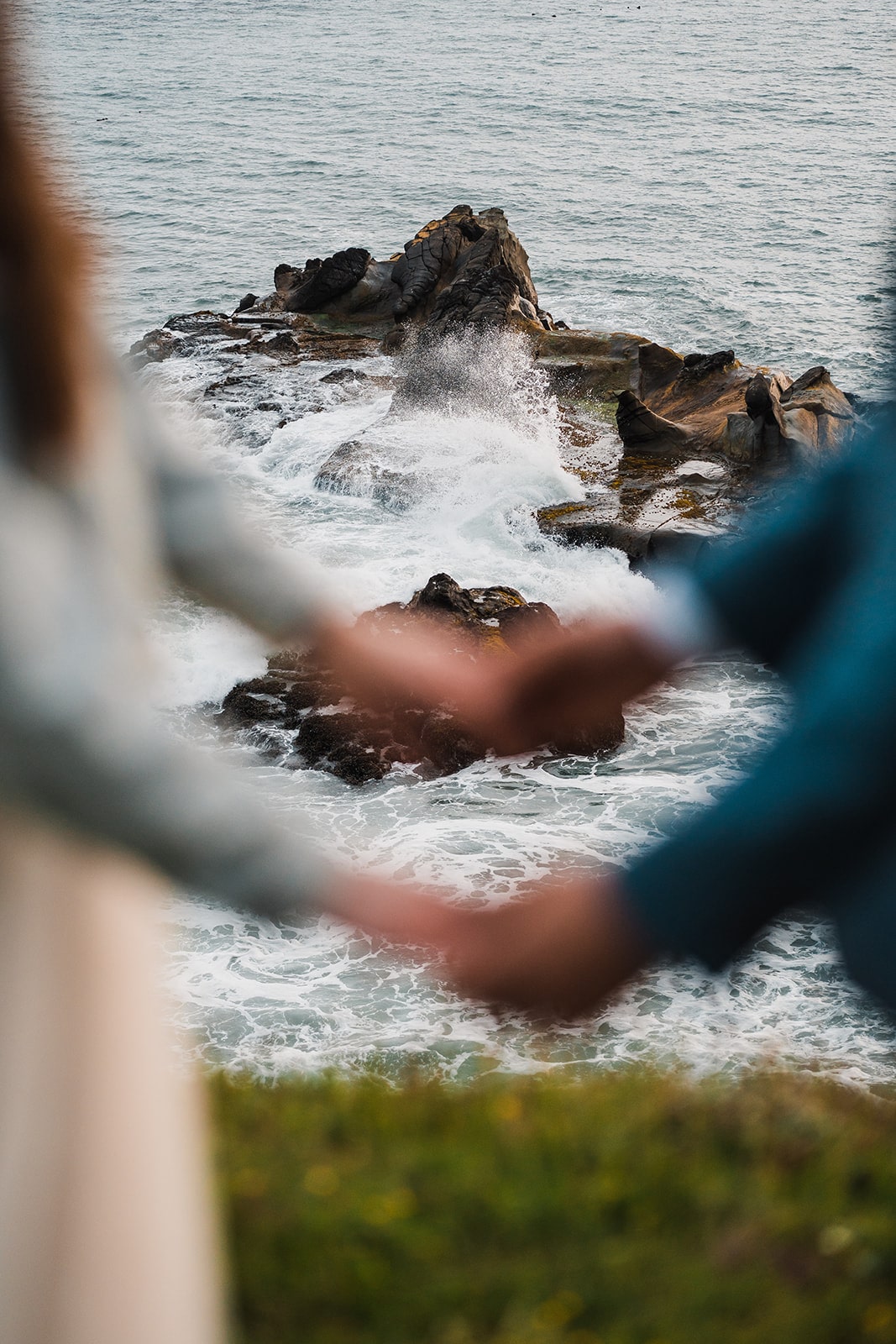 Bride and groom hold hands during their Oregon micro wedding by the coast