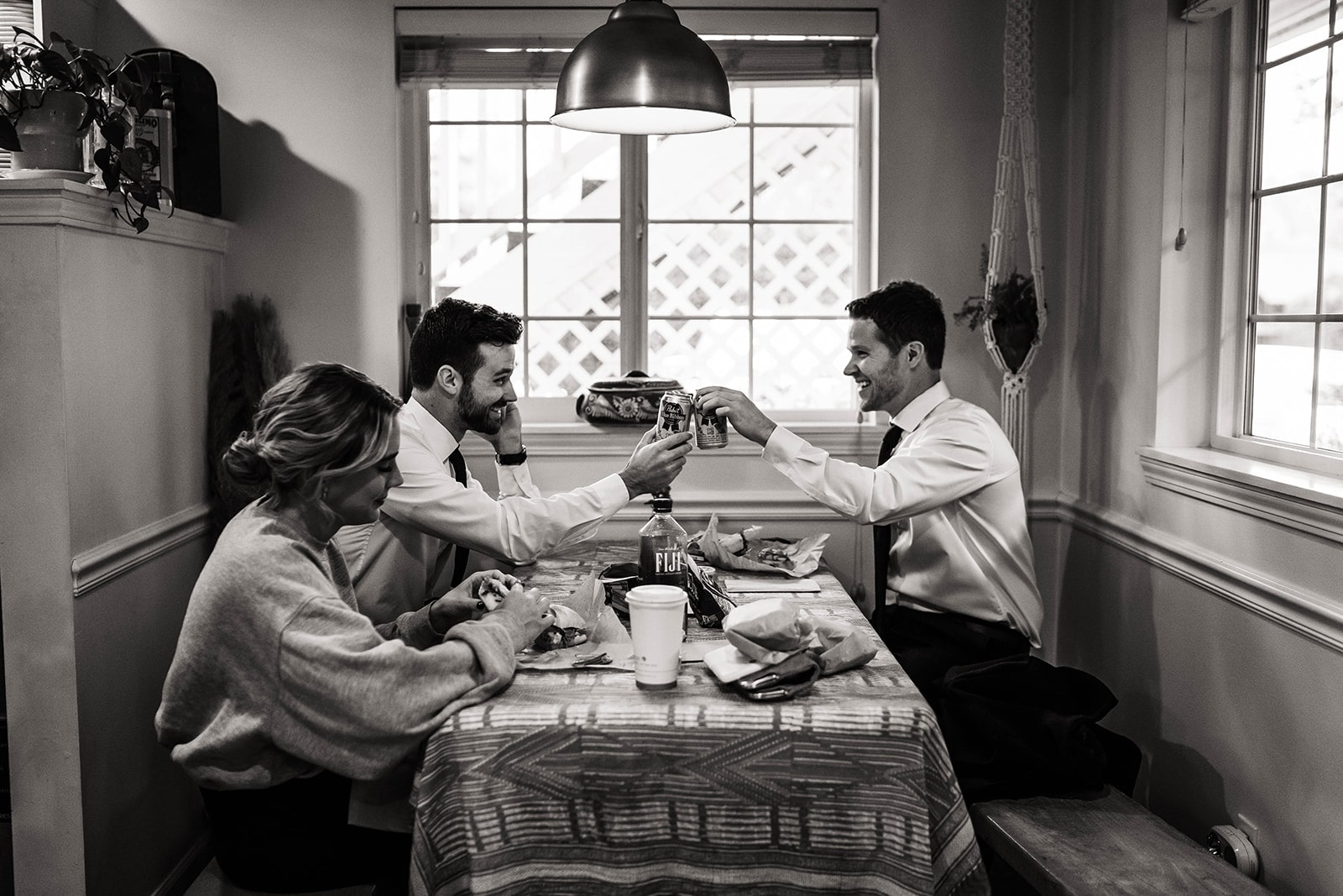 Guests toast beer at their micro wedding venue meal in Oregon