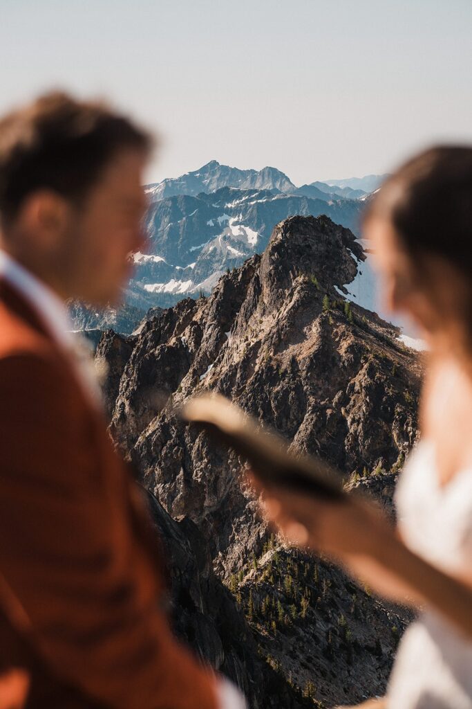 Bride reads private vows during their rock climbing elopement in the North Cascades