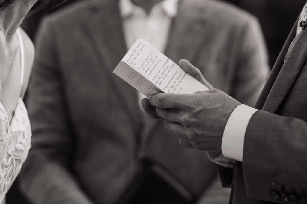 Groom reads personal vows during his elopement ceremony in North Cascades National Park