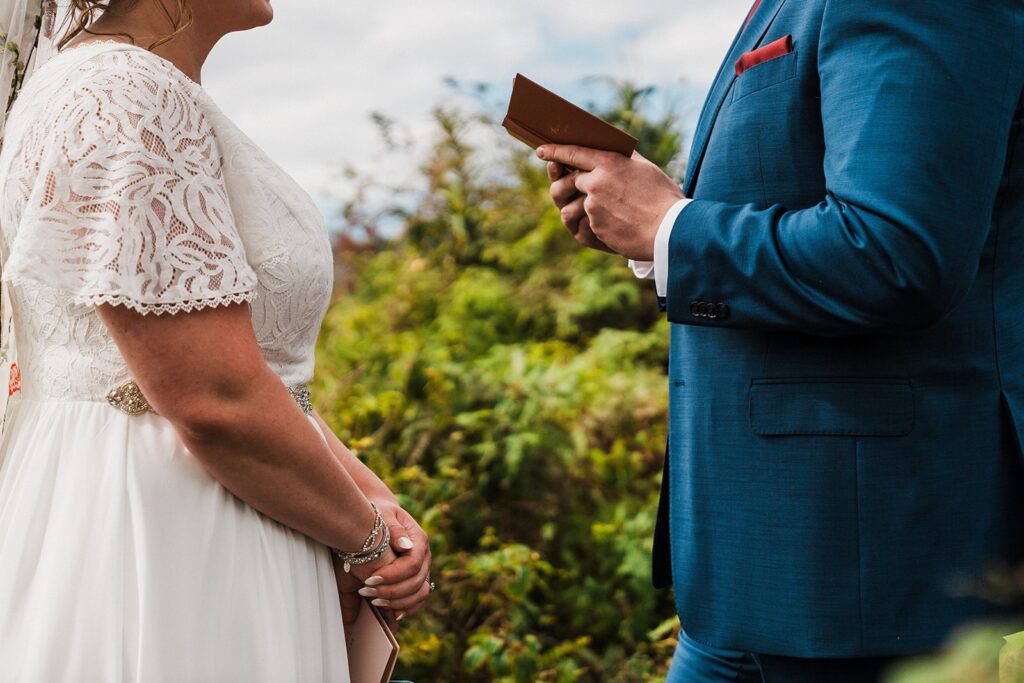 Bride and groom read private vows in the rainforest during their Kauai elopement 