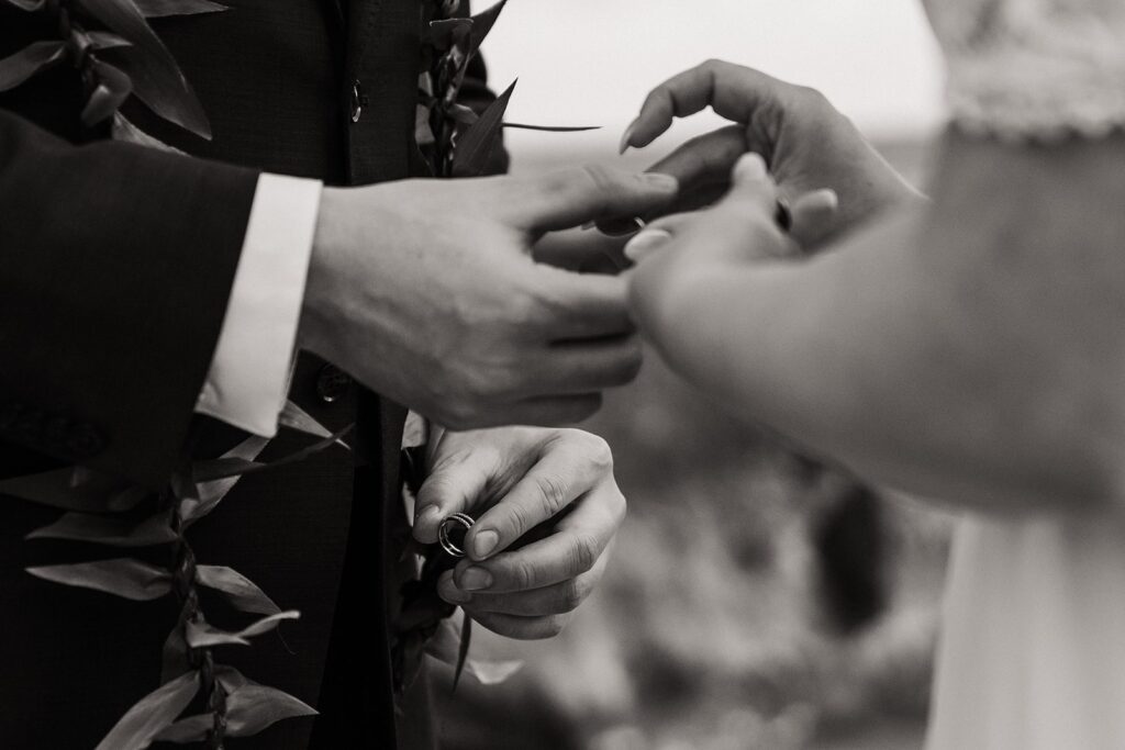 Bride and groom exchange rings during their elopement in Kauai 