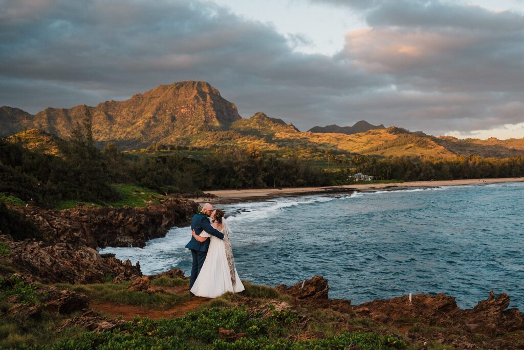 Bride and groom kiss on the cliffs during their Kauai Hawaii elopement 