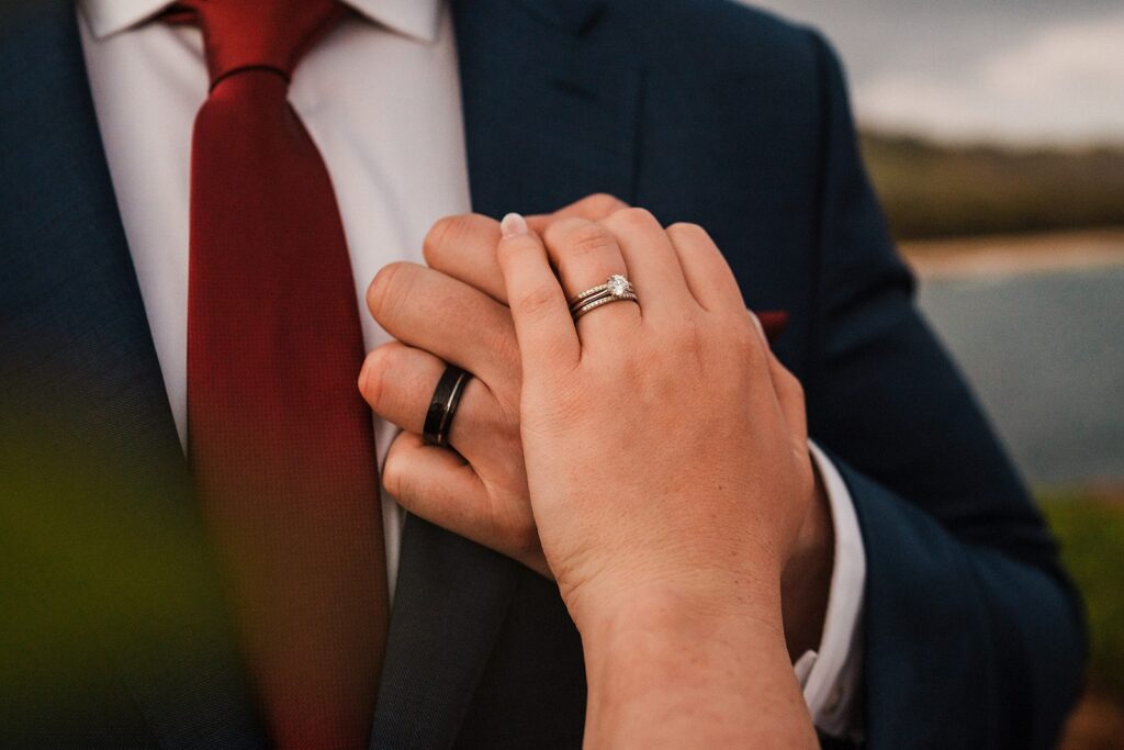 Bride and groom hold hands during their sunset Kauai elopement 