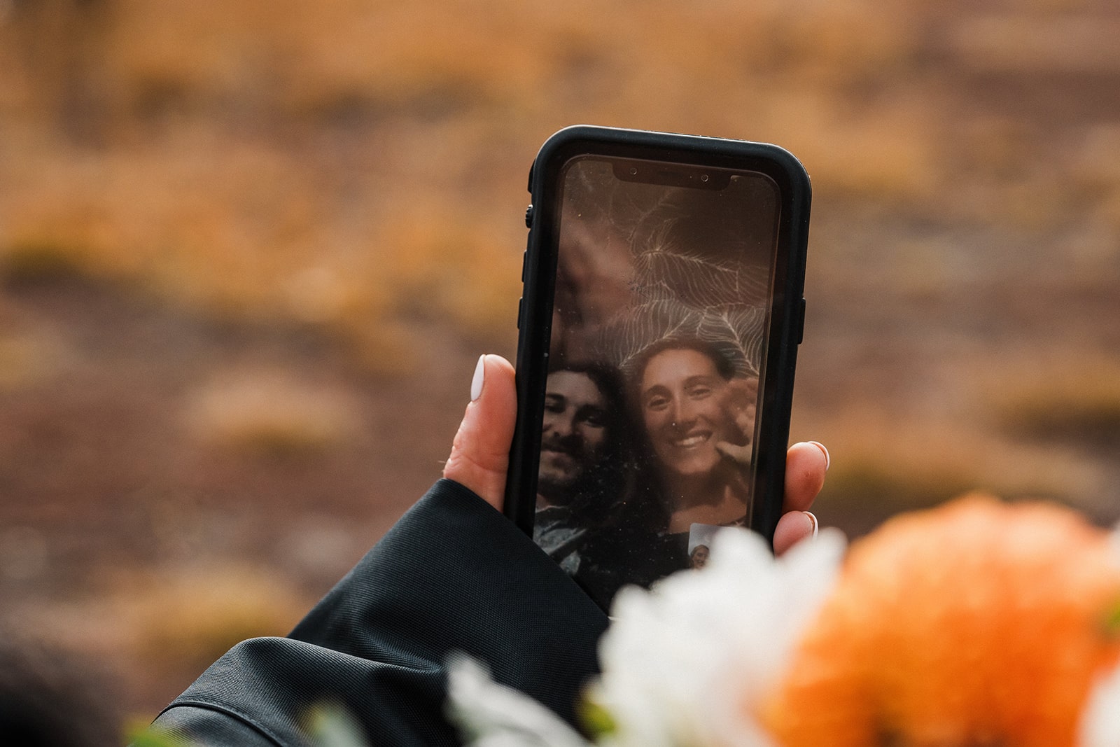 Bride and groom facetime loved ones after their fall wedding ceremony in Washington