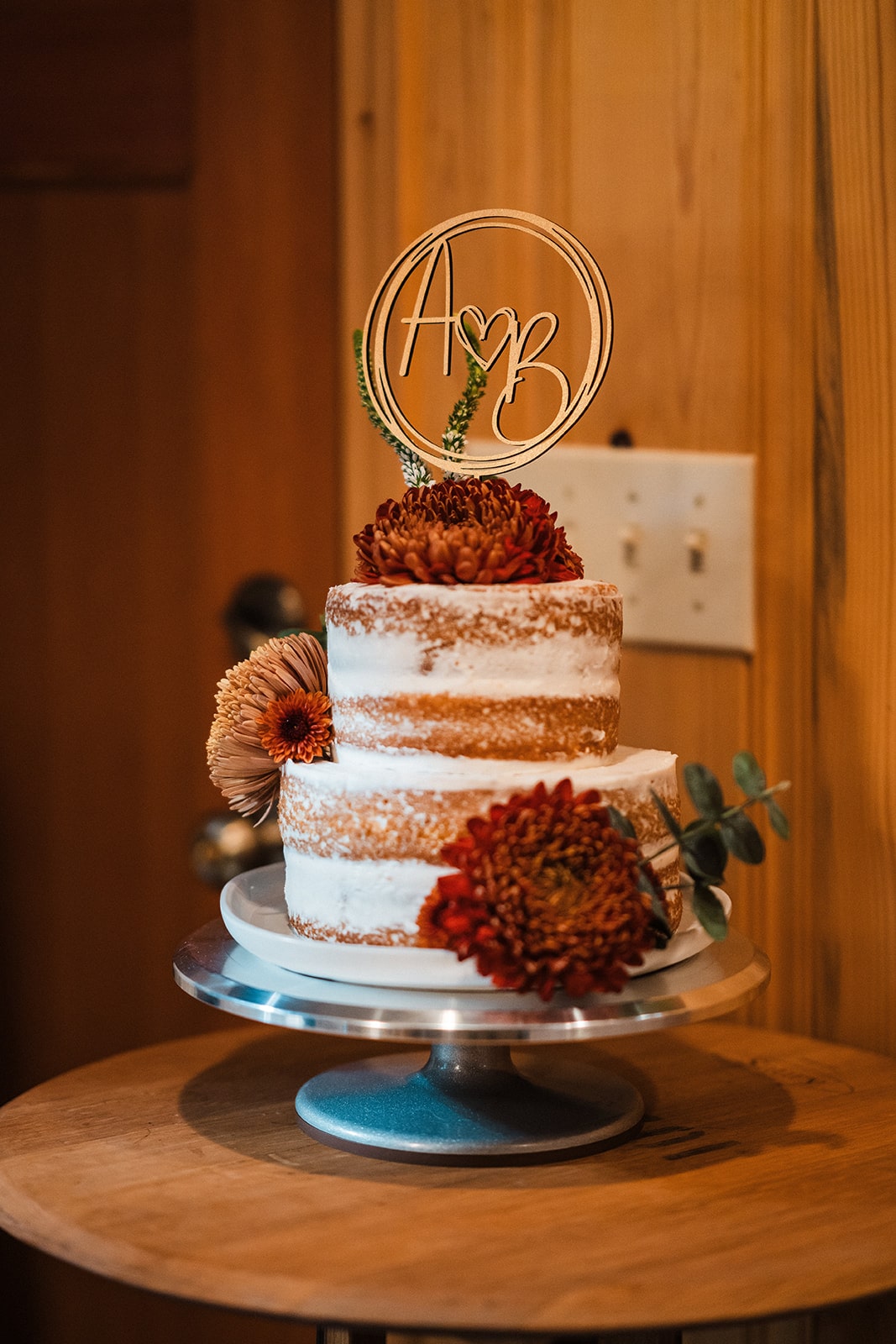 Two tier wedding cake with A and B custom wood cake topper