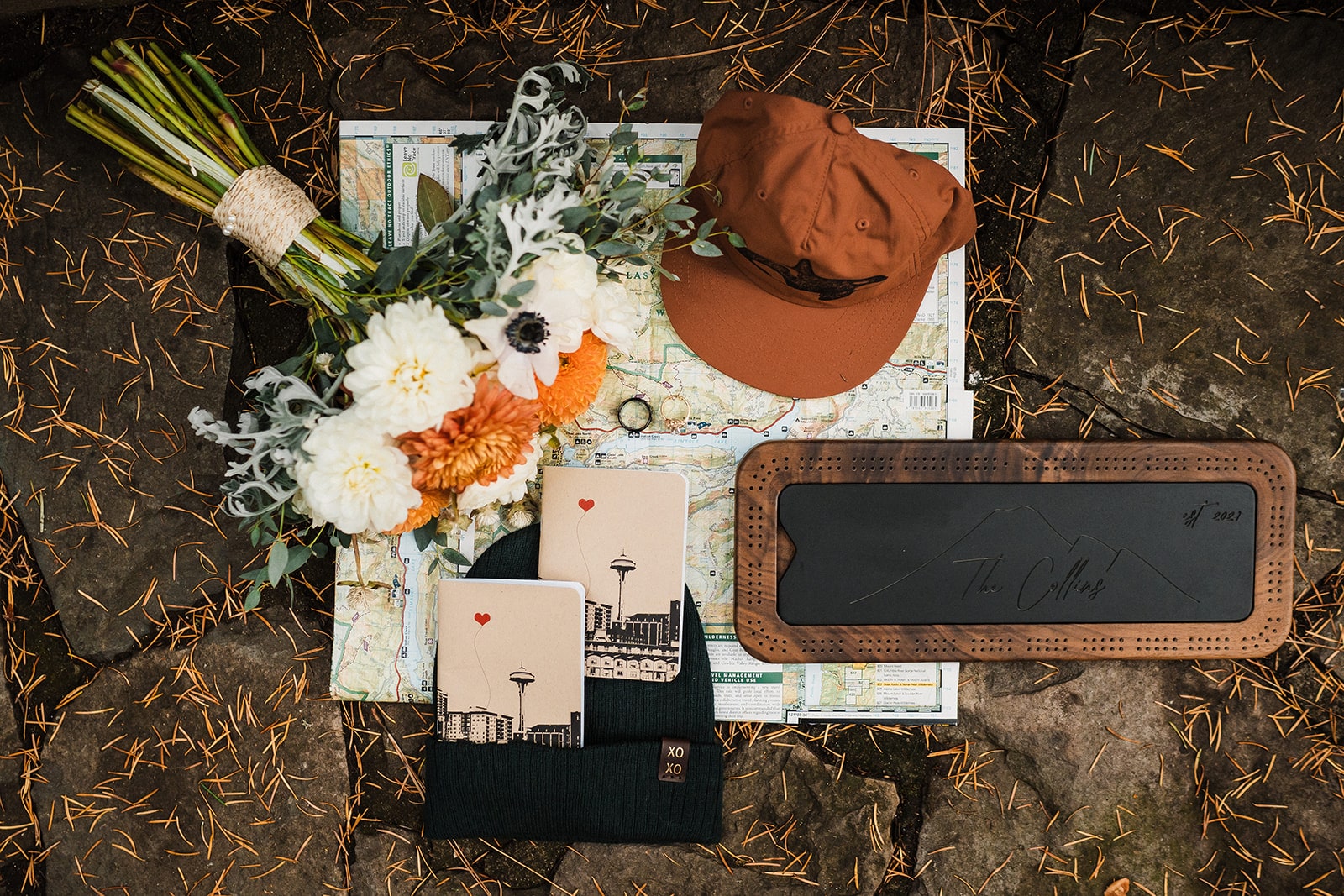 Orange and white fall wedding details and custom vow books and sign