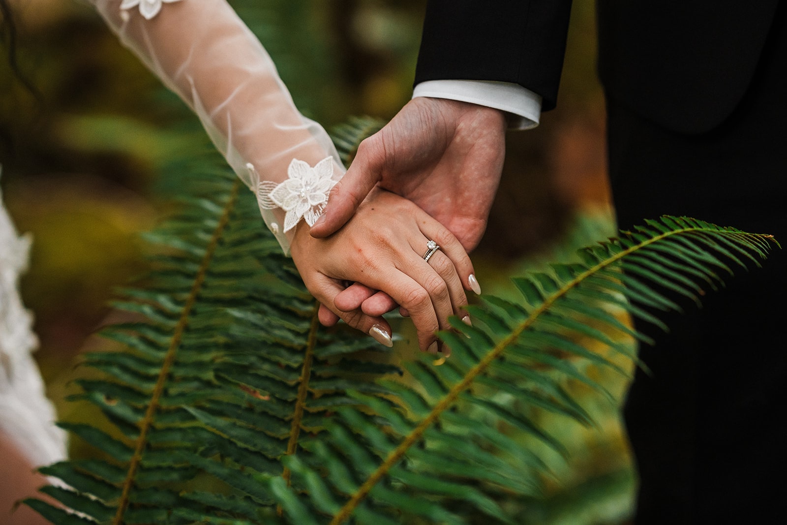 Bride and groom hold hands in the forest at the Mt Baker elopement 