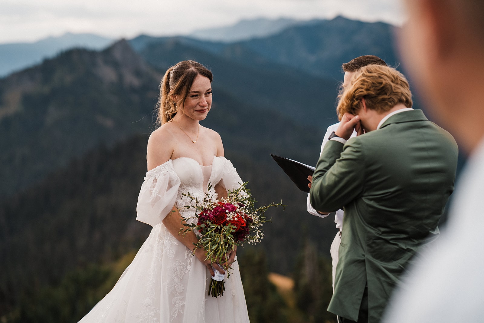 Bride and groom get emotional during their mountain elopement ceremony at Hurricane Ridge