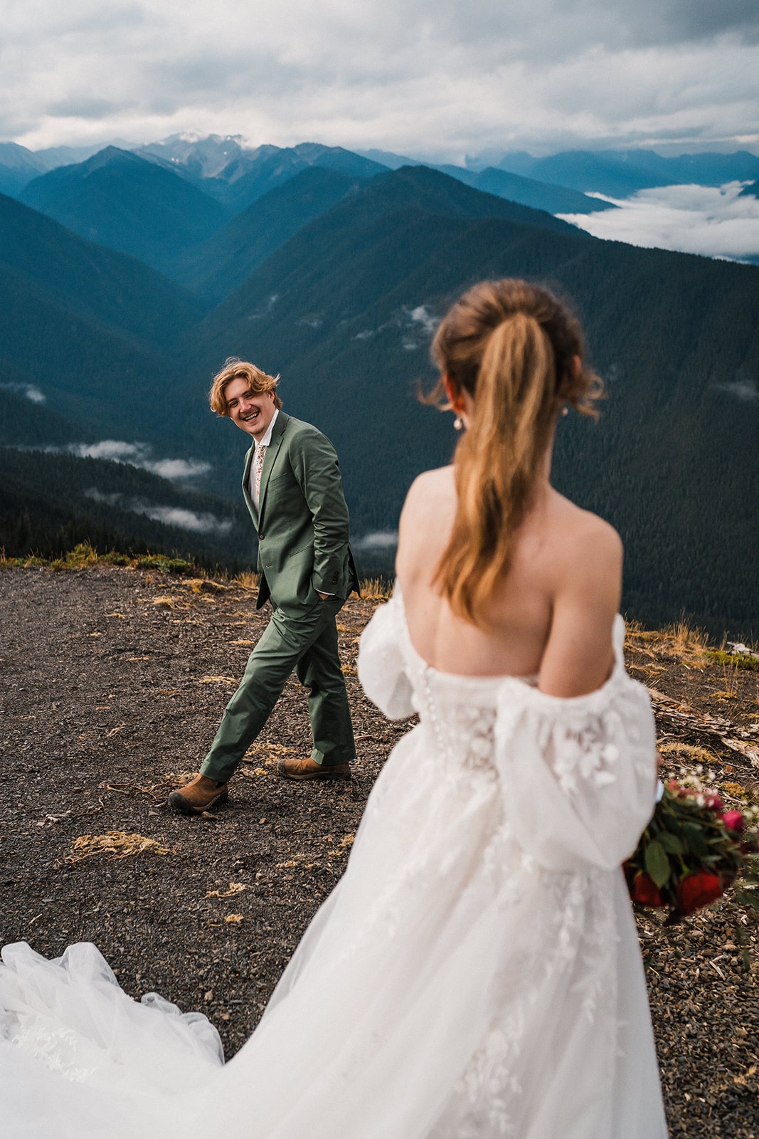 Groom smiles at bride during their couple portraits at Hurricane Ridge