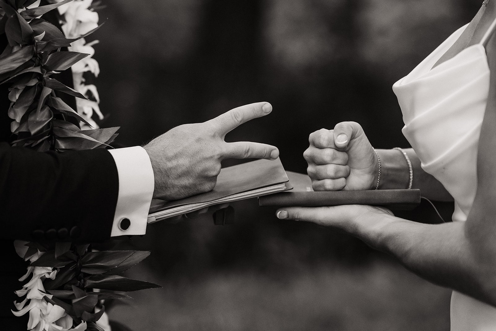 Bride and groom play rock, paper, scissors to see who reads their private vows first.