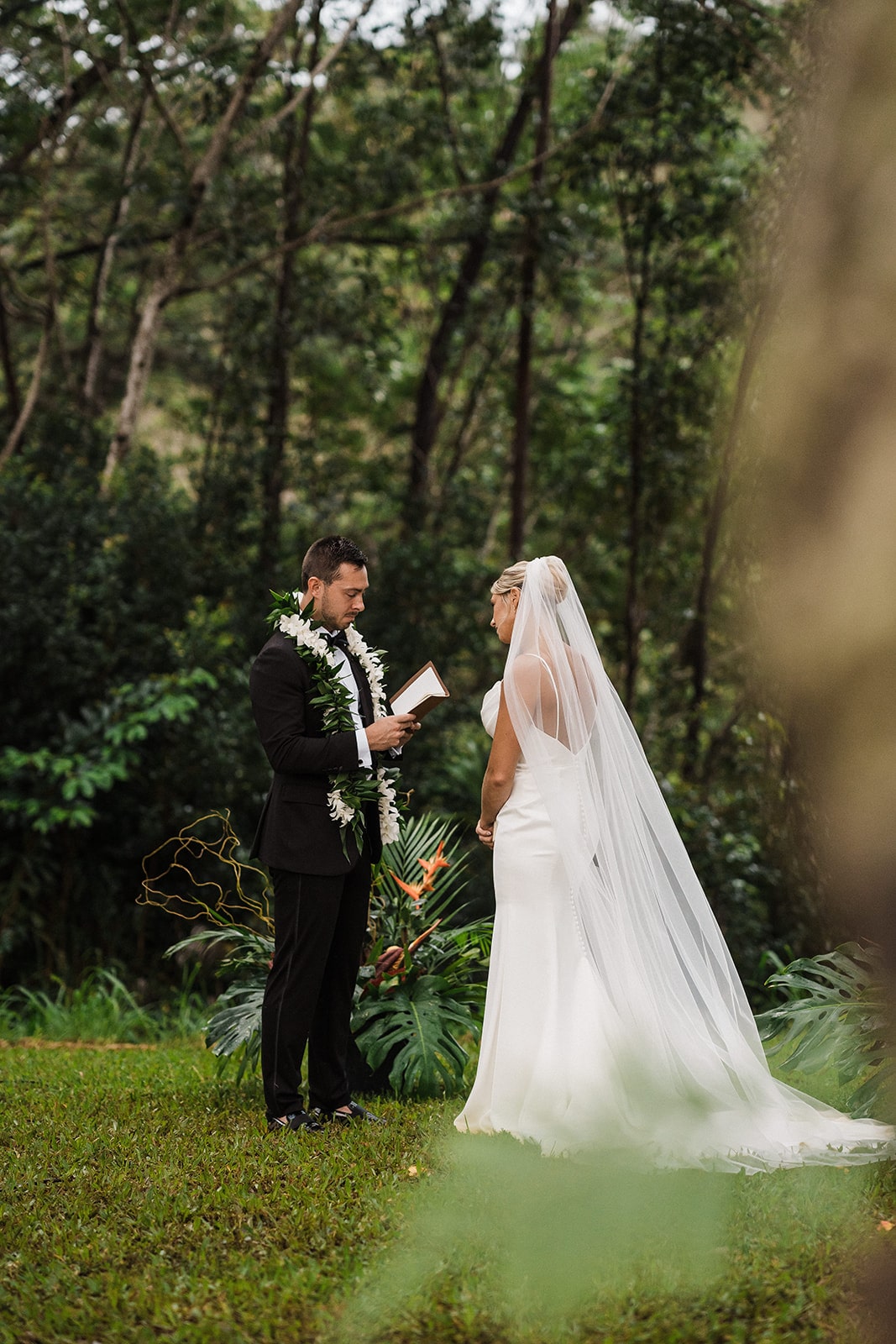 Groom reads private vows to bride during their three-day wedding weekend in Kauai.