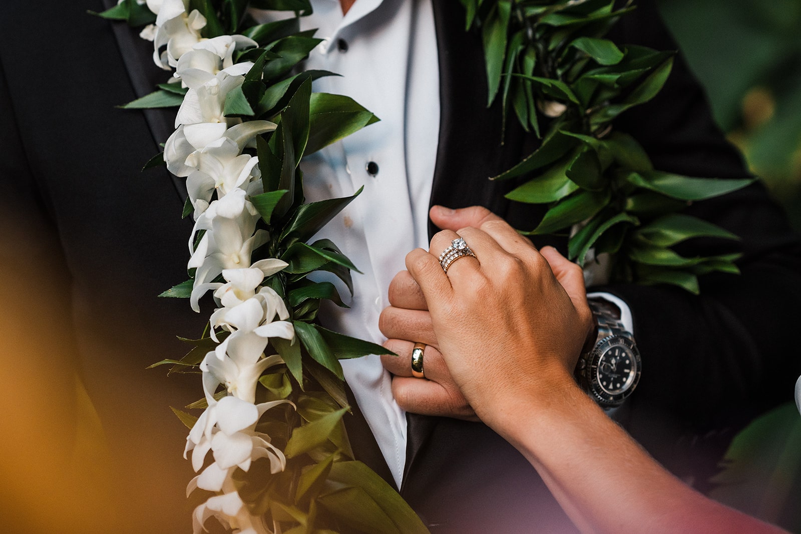 Bride and groom hold hands during their Kauai wedding.