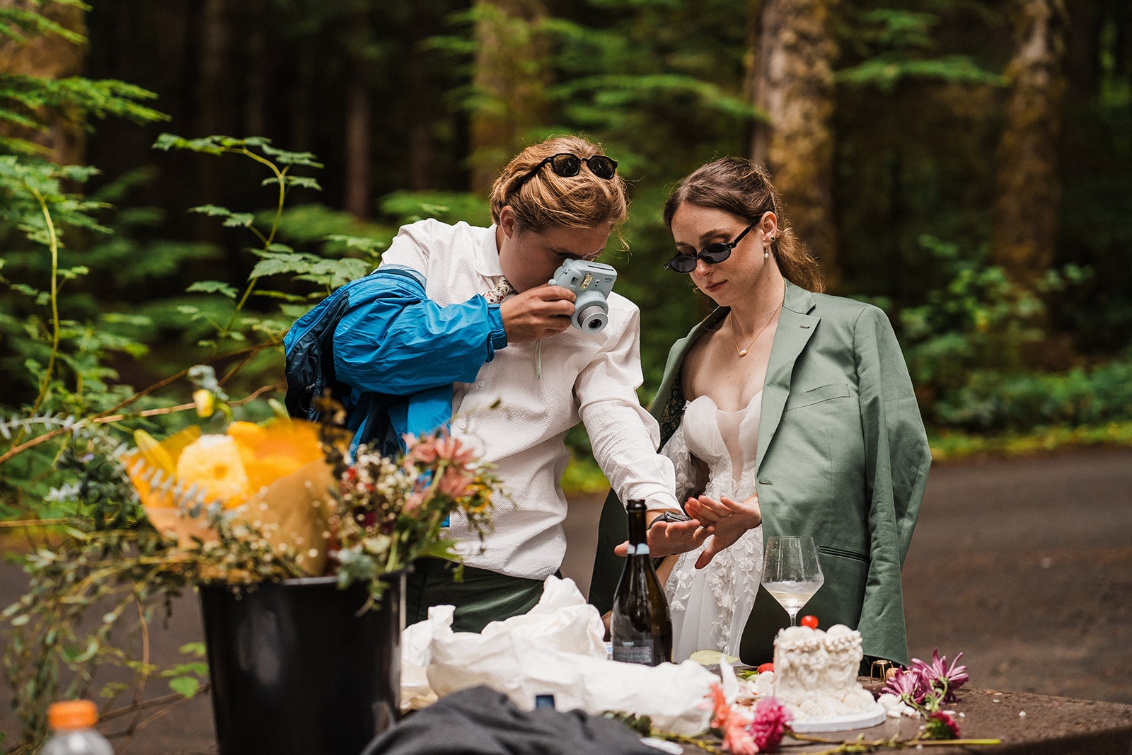 Bride and groom take a polaroid photo of their wedding rings during their multi-day wedding in Washington.