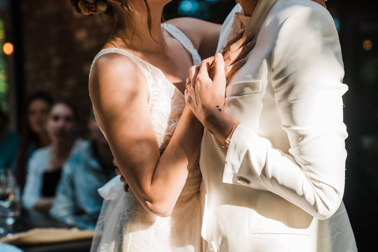 Two brides slow dance on the deck during their multi-day wedding in Washington.
