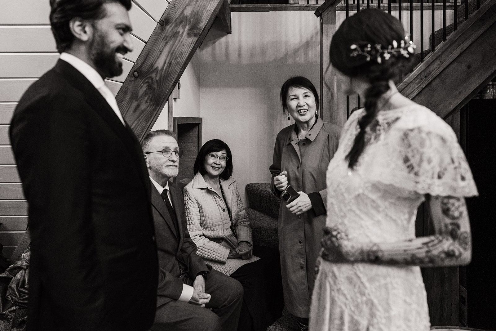 Bride's mother smiles at her during their elopement reception revealing the bride wearing her mother's wedding dress. 