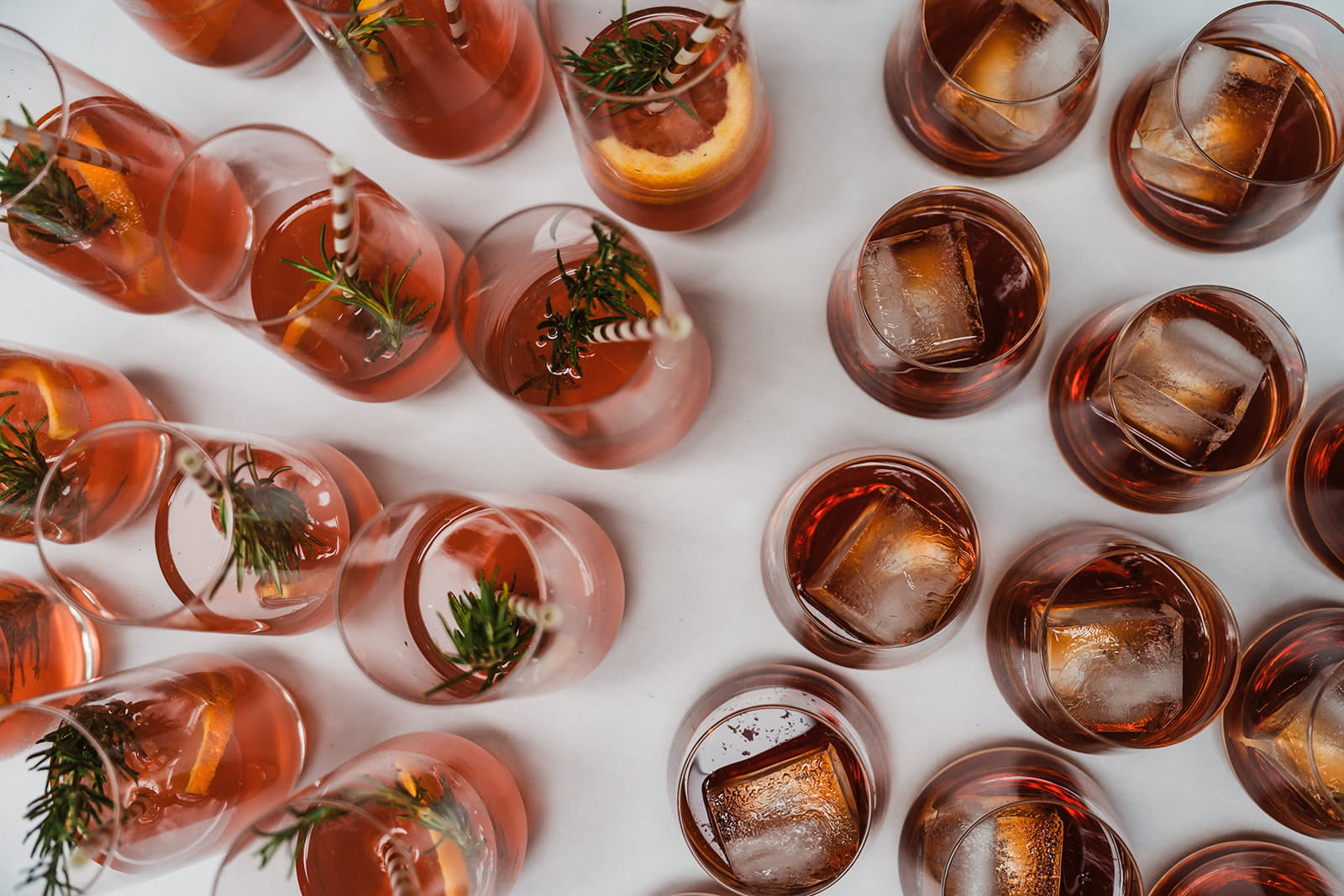 Red sangrias with striped straws. 