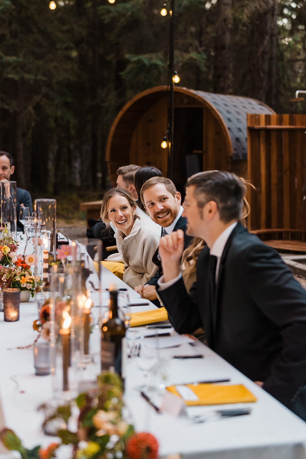 Newlyweds mingle with guests during their intimate wedding dinner in Snoqualmie. 