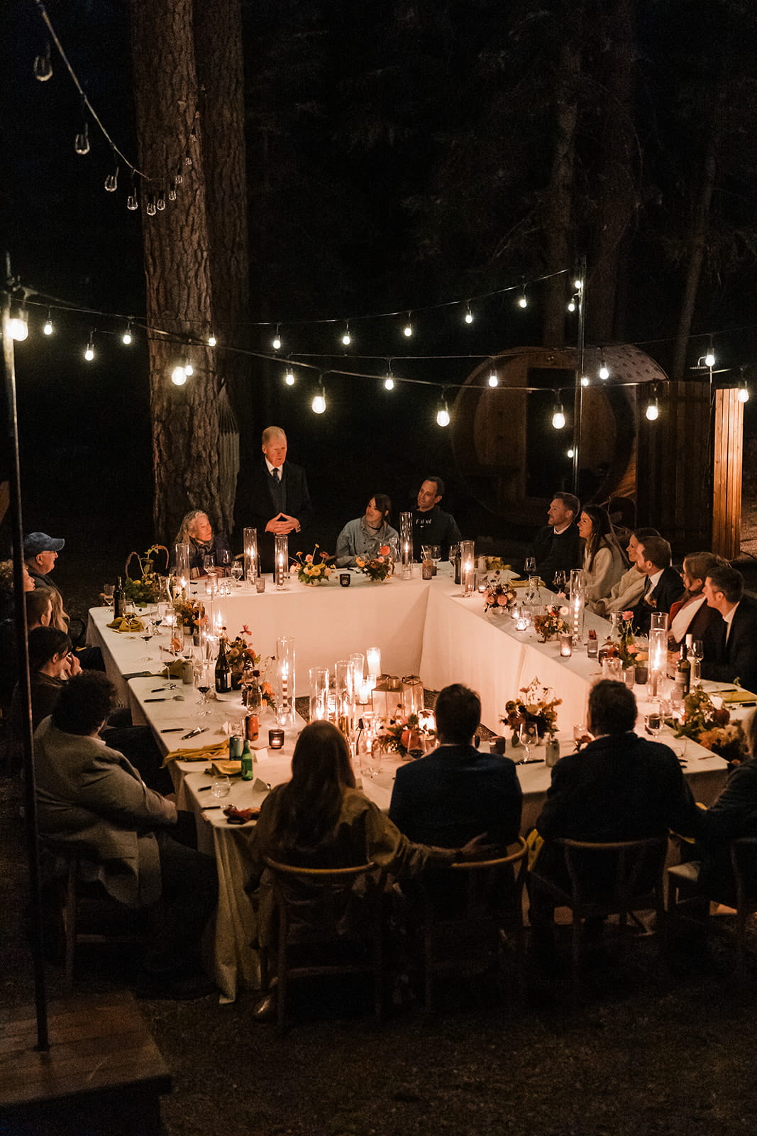 Guest gives a speech at a candlelight wedding reception dinner in Snoqualmie, Washington. 