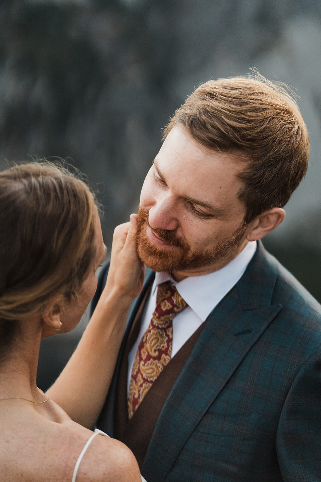 Couple looks into each other eyes during their backpacking elopement photos. 