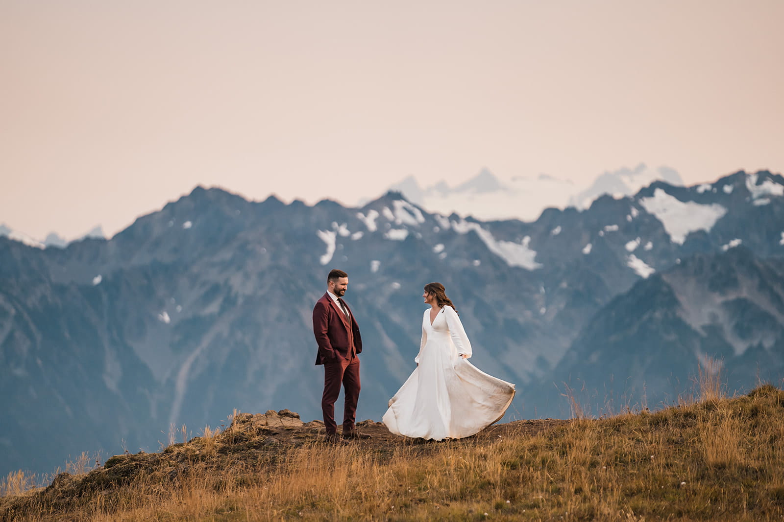 Newlyweds dance on a mountain trail at sunset during their wedding at Hurricane Ridge.