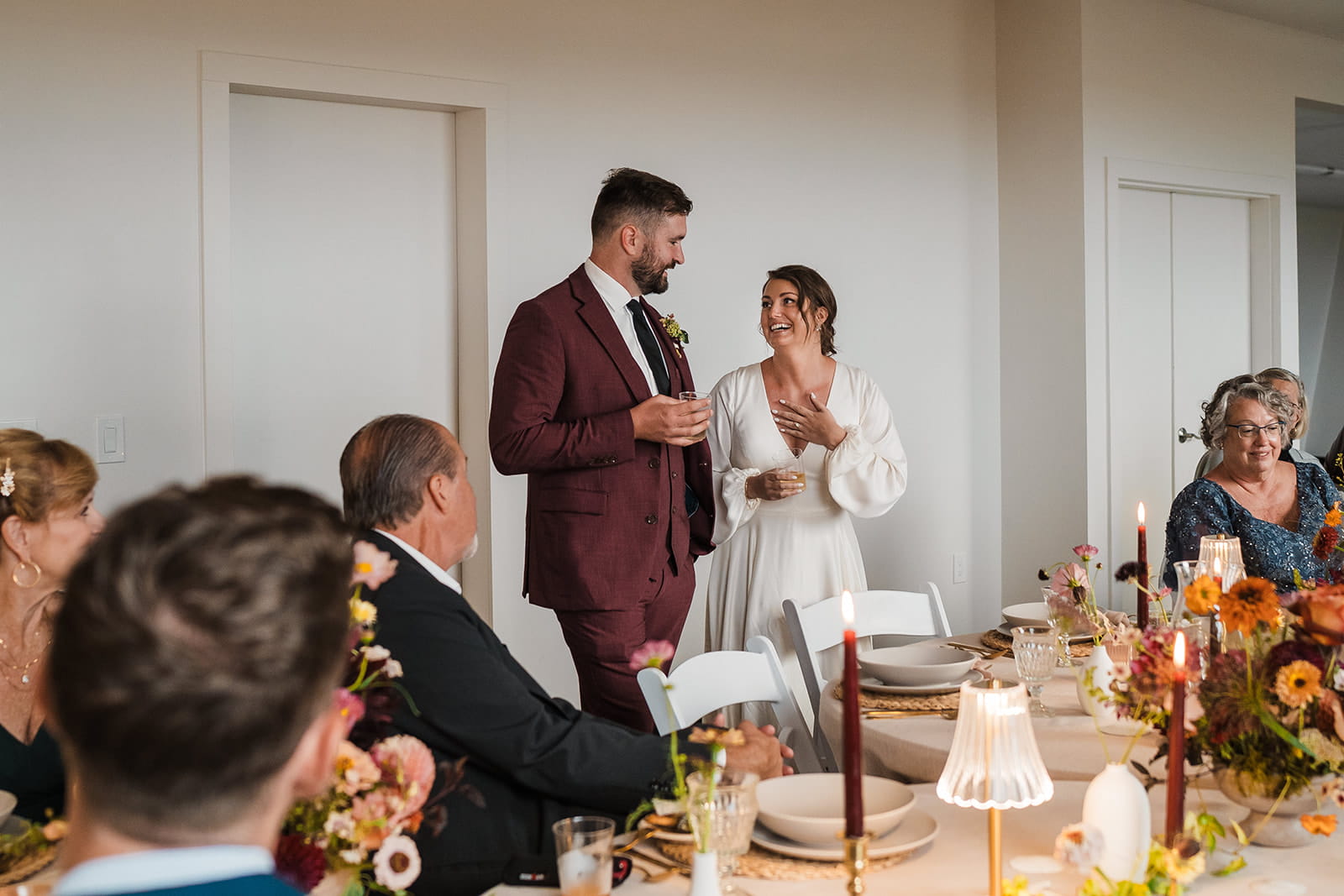 Newlyweds give speeches during their micro wedding dinner at Agate Lodge. 
