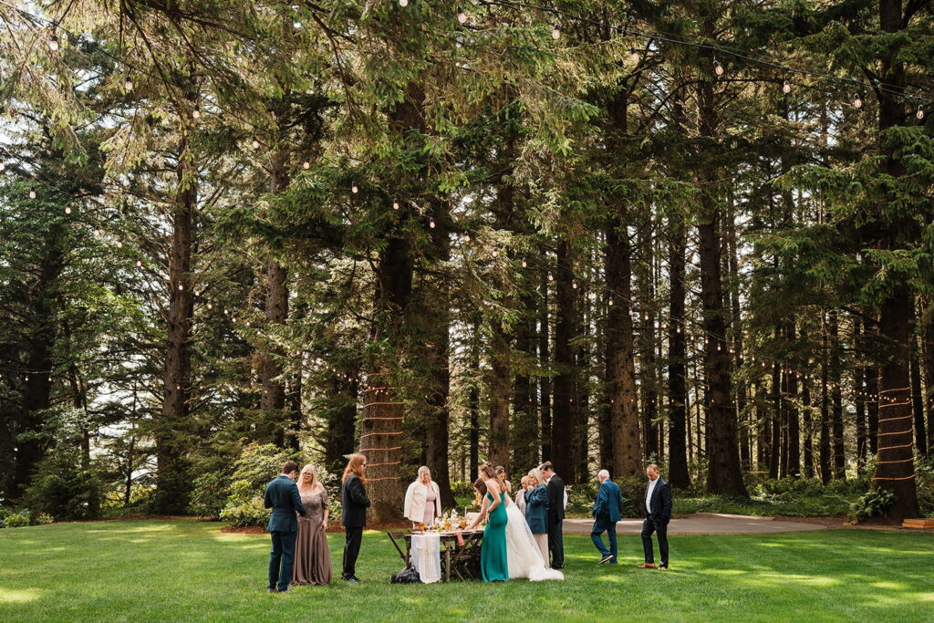 Guests mingle on the lawn at a micro wedding venue in Oregon.
