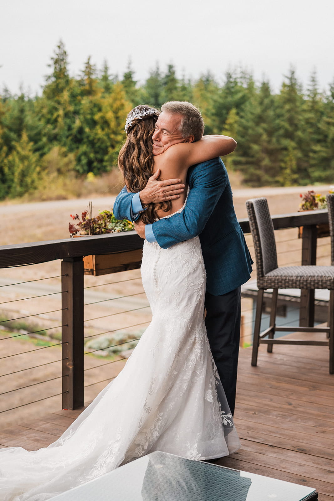 Bride hugs father after first look at her Port Angeles wedding.
