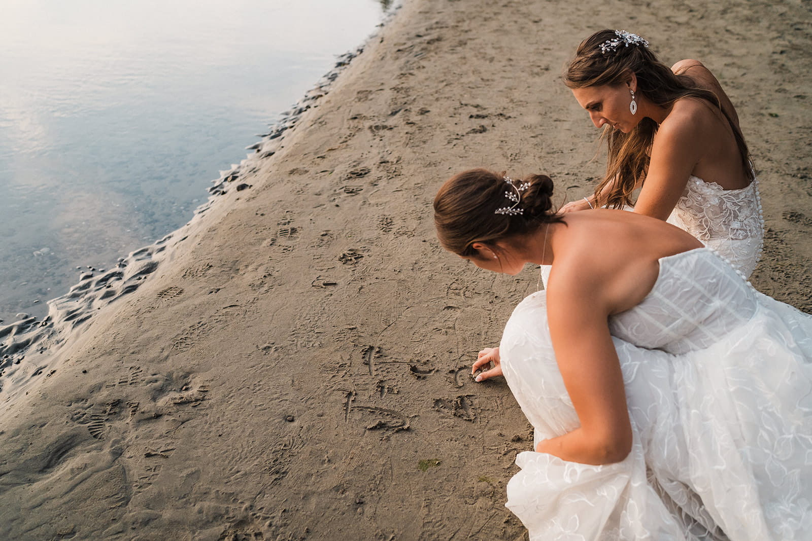 Brides comb the beach during their Port Angeles adventure wedding.