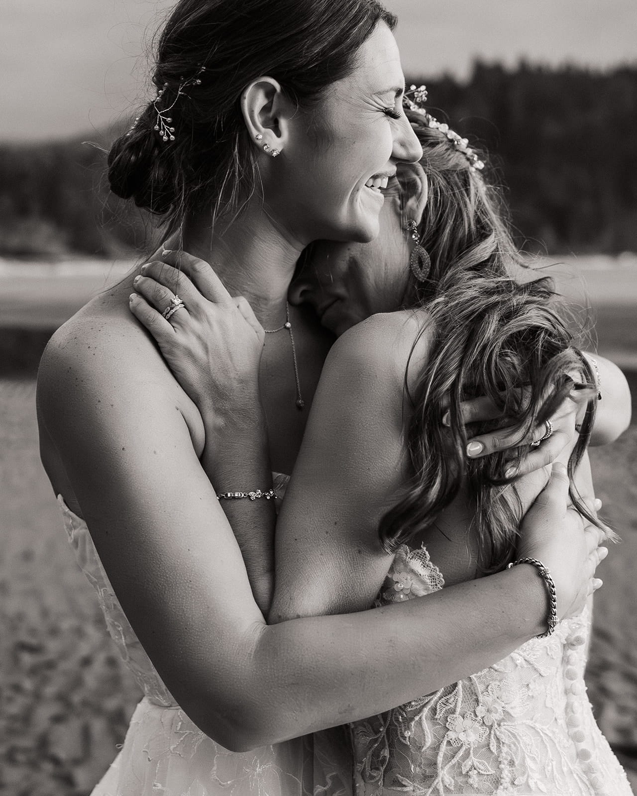 Brides hugs on the beach at sunset.