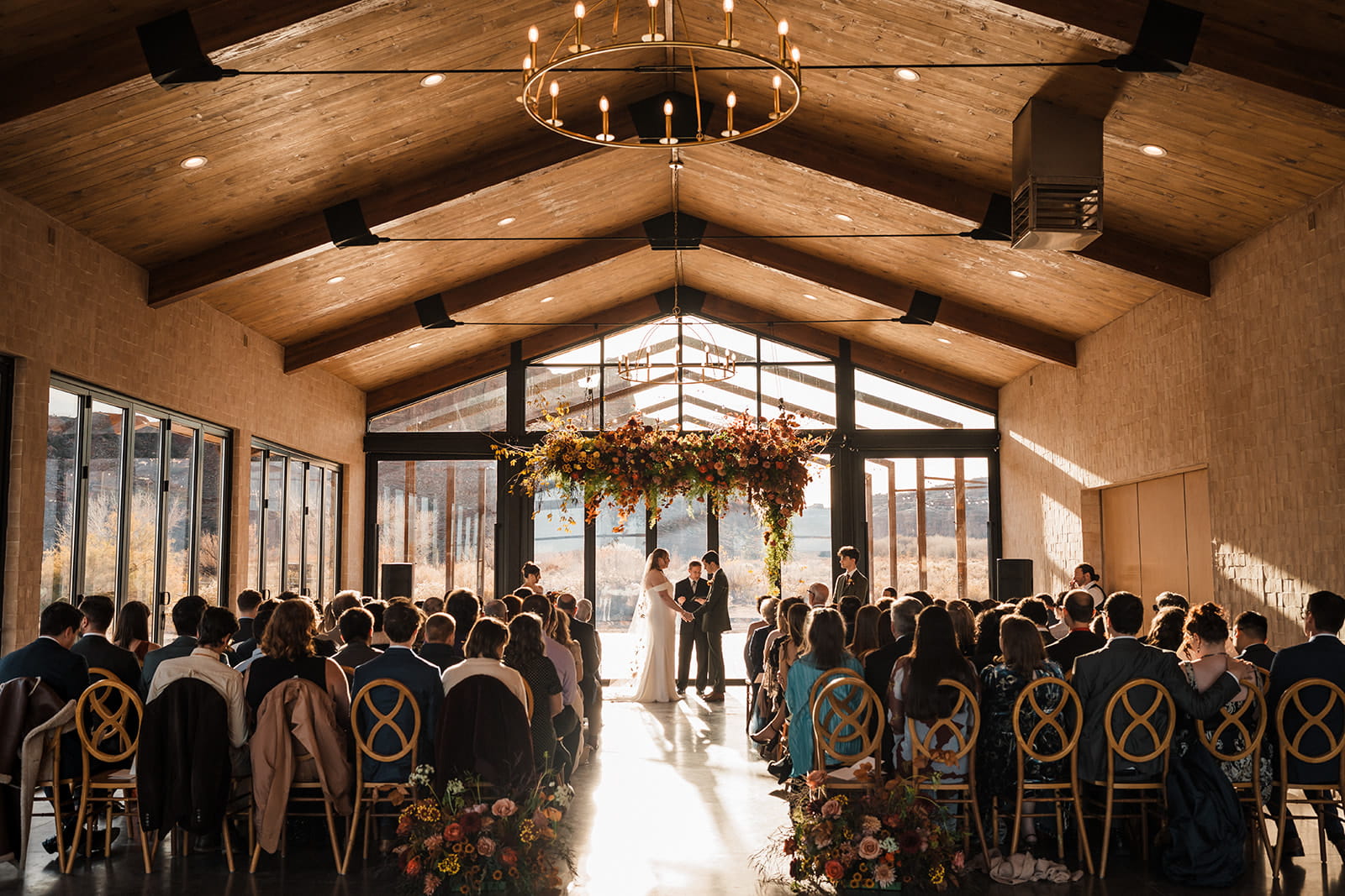 Indoor wedding ceremony at Red Earth venue. 
