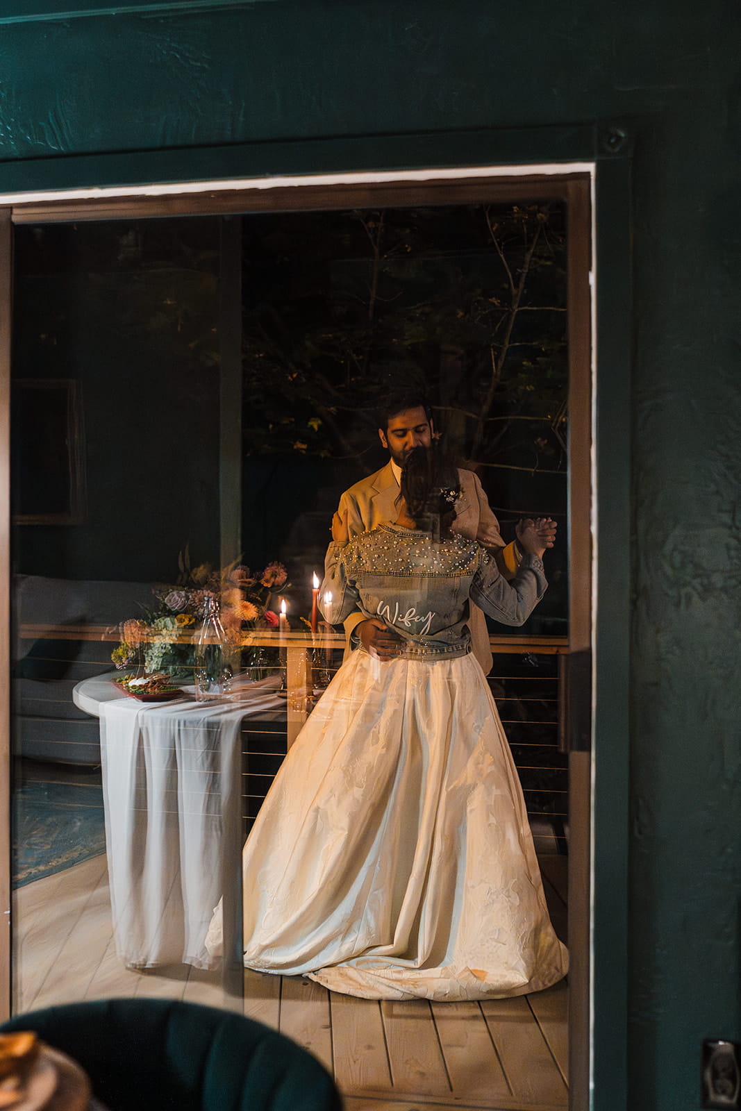 Bride and groom dance in their Airbnb cabin at the end of their elopement day. 